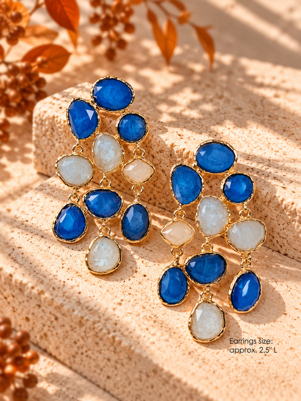 Gold-tone statement chandelier earrings with cobalt blue and ivory stones