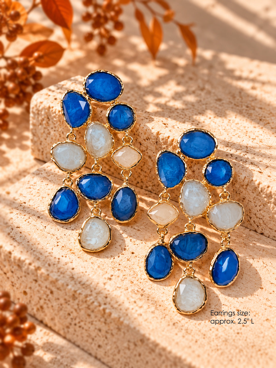 Gold-tone statement chandelier earrings with cobalt blue and ivory stones