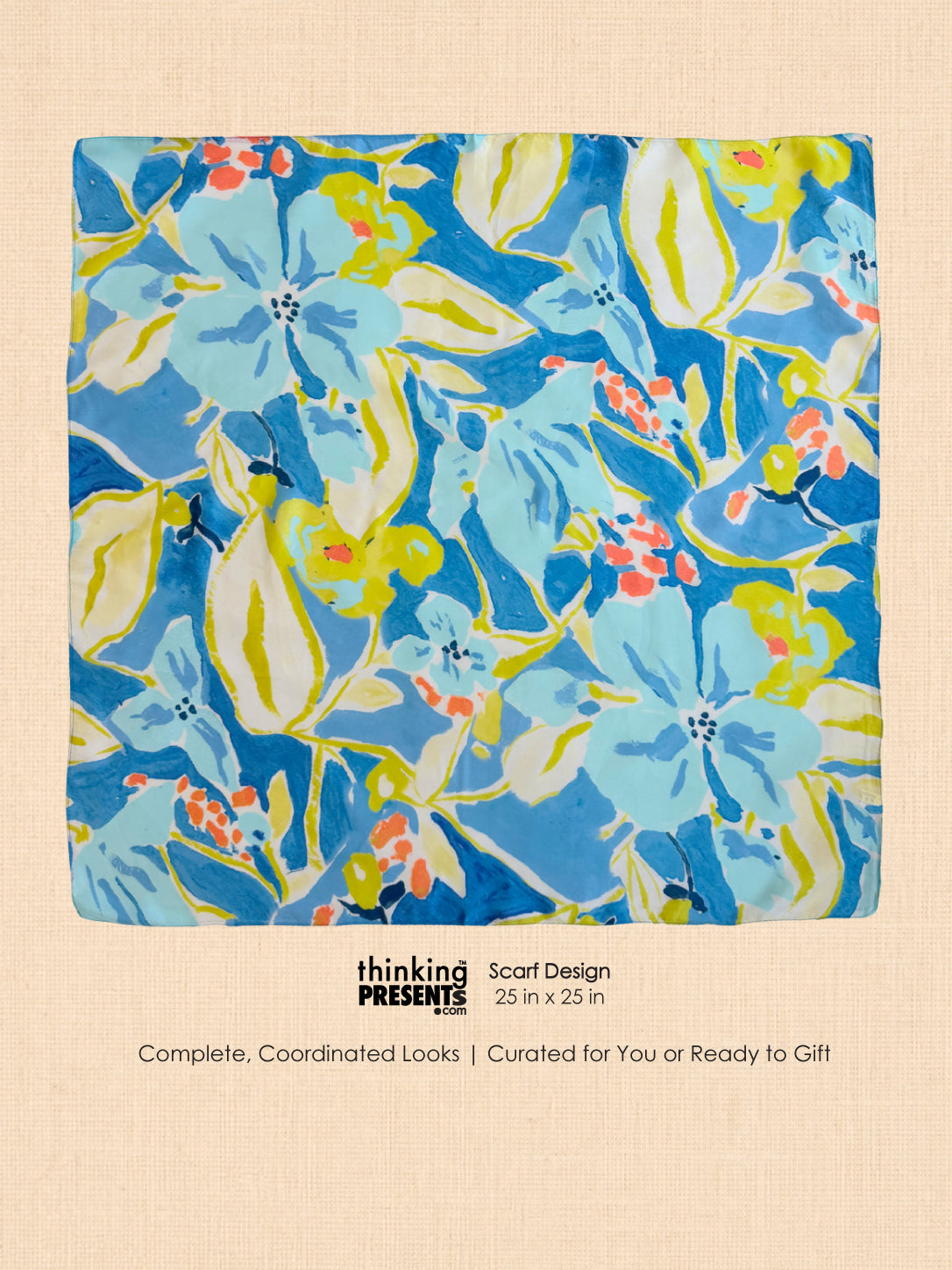 A square scarf with a vibrant floral pattern in blue, yellow, and coral pink, presented on a textured beige background with descriptive text below.