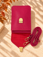 Fuchsia pink crossbody bag open showing interior and adjustable strap