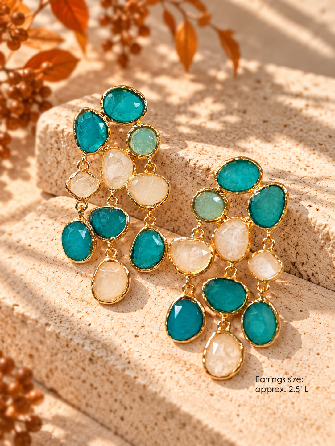 Gold-tone statement chandelier earrings with teal, mint, and ivory acrylic stones, approx. 2.5 inches long