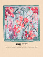 Silky square scarf with watercolor coral lilies and sage leaves on cream with a green striped border, 25 x 25 inches