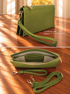An olive green pebbled leather crossbody pouch with gold-tone hardware, shown in two views on a wooden surface. The top view shows the closed bag with its wristlet strap, and the bottom view shows the open pouch with interior card slots and the strap laid out beside it.