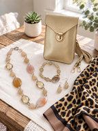The Gold Chic Edit curated set by Thinking Presents with gold crossbody bag, natural stone necklace, bracelet, earrings and leopard-print scarf