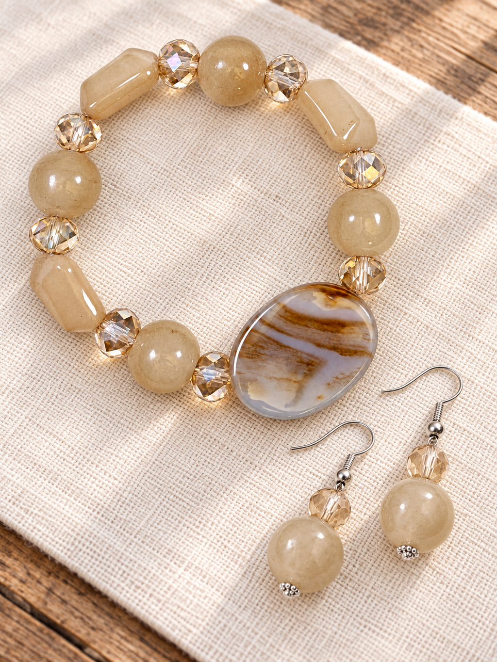 Natural stone stretch bracelet and drop earrings in cream and caramel with faceted glass accents by Thinking Presents