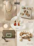 Curated gift set featuring layered gold-tone necklaces, statement earrings with warm amber stones, five-piece ring set with mixed textures, neutral crossbody bag with embellished buckle, and stackable beaded bracelets, styled as an elegant ready-to-gift set