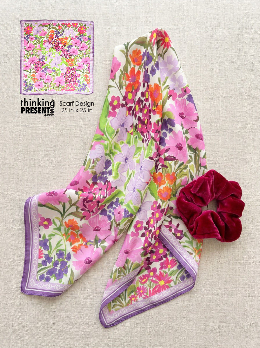 Floral scarf with a scrunchie on a textured surface