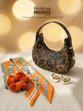 Leopard print mini hobo bag shown from multiple angles with gold hardware and zipper details on a warm neutral background.