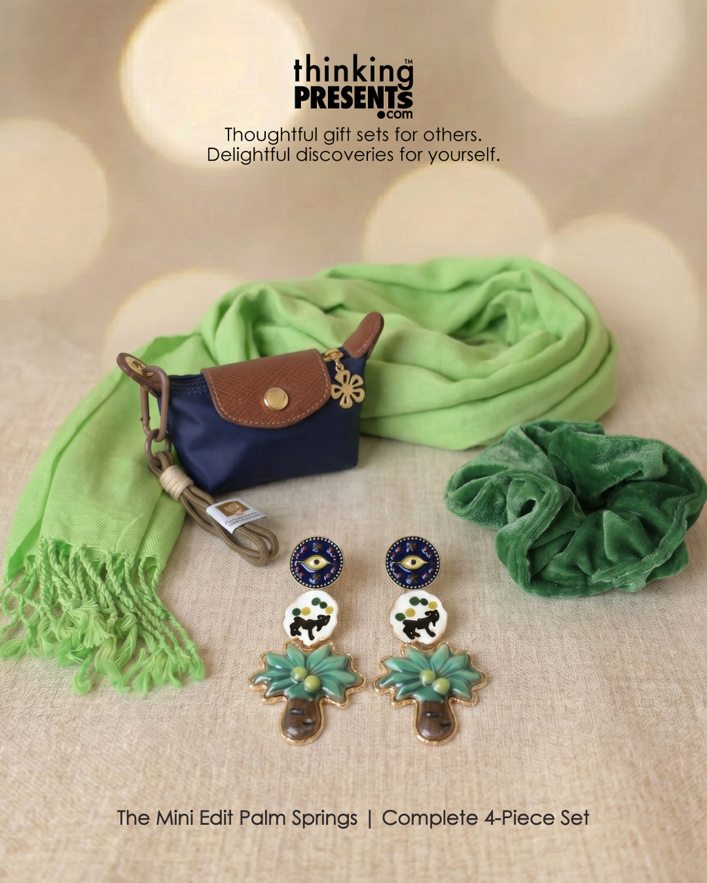 Set of earrings, a purse, and a green scarf with 'thinking PRESENTS' branding.