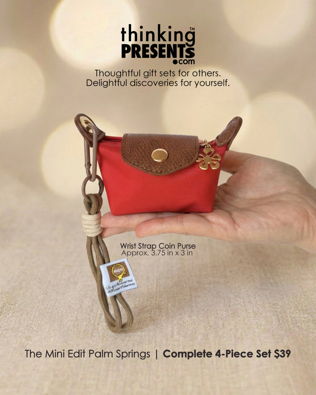Red wrist strap coin purse held by a hand with 'thinking PRESENTS' branding.