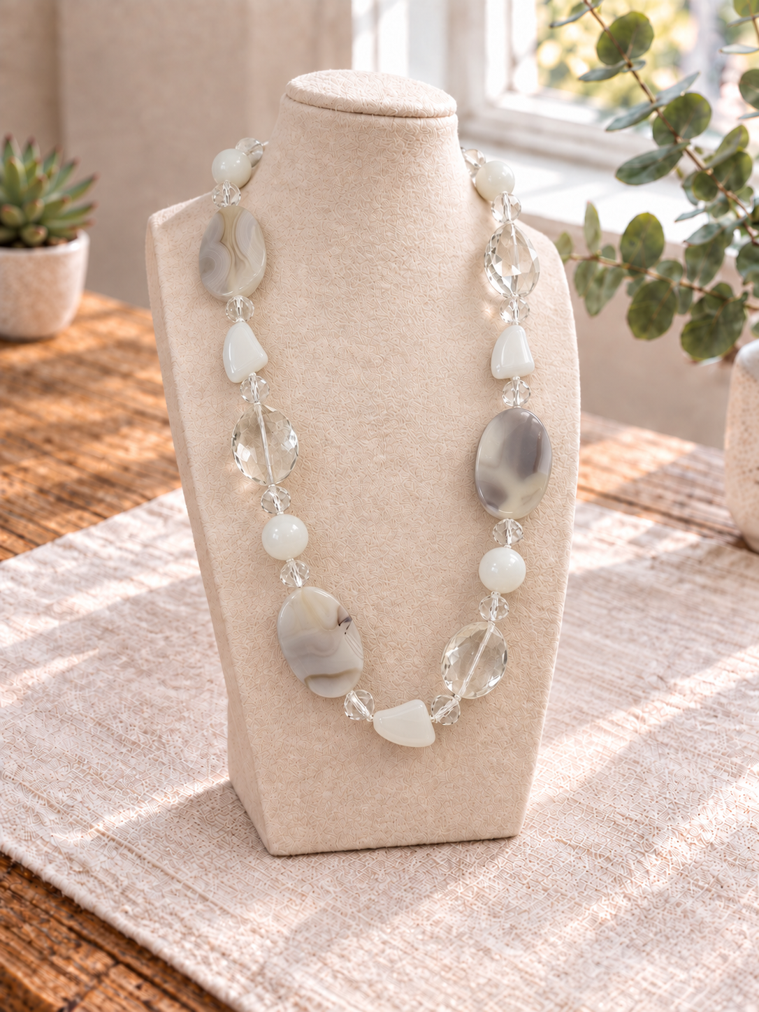 Long white stone necklace with grey-veined agate ovals and faceted clear glass beads from The Silver Chic Edit