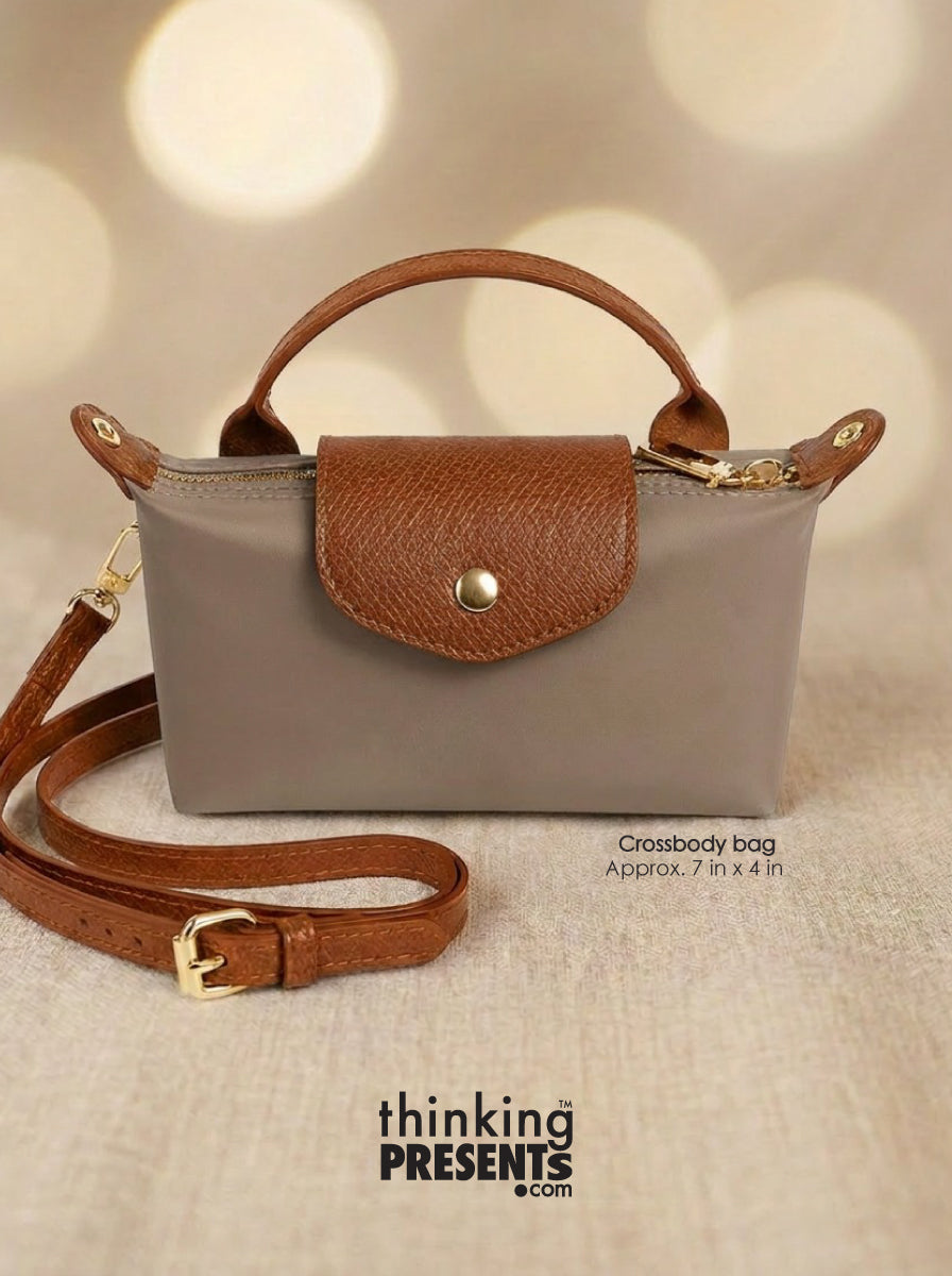 Taupe crossbody with brown handle and strap on a beige background, featuring 'thinking PRESENTS'.com' branding.