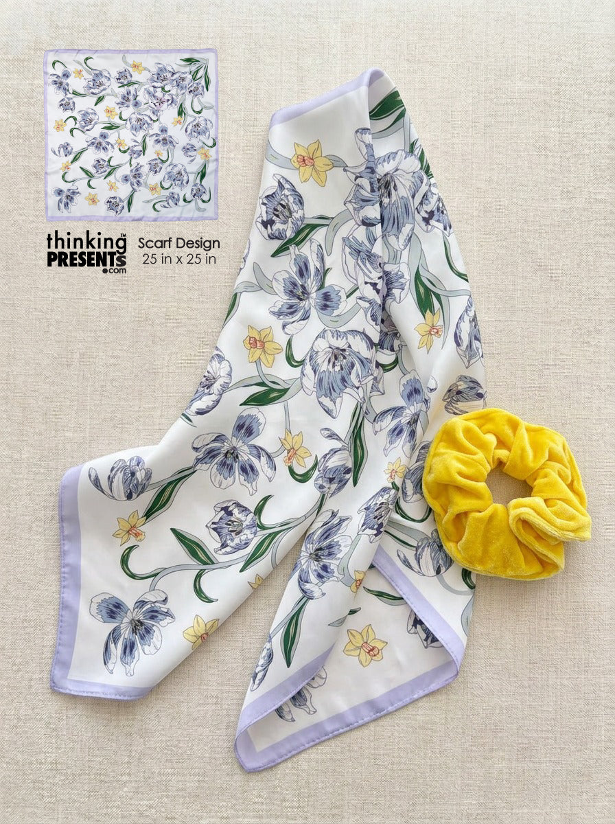 Silky floral scarf with soft lavender trim and delicate blue and yellow flowers, paired with a plush yellow scrunchie, styled as part of a feminine curated gift set by Thinking Presents™